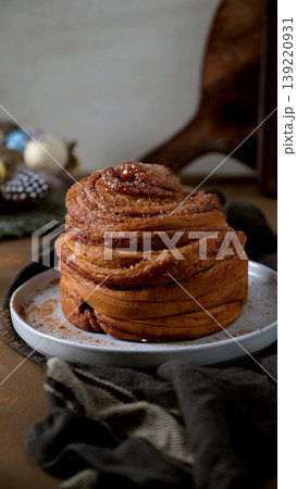 Artisanal Cinnamon Sugar Cruffin on Plate with Easter Decorations Artisanal Cinnamon Sugar Cruffin on Plate with Easter Decorations 139220931