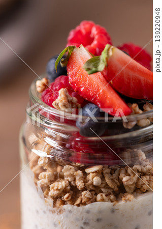 Healthy Chia Pudding and Granola Parfait Topped with Fresh Berries Healthy Chia Pudding and Granola Parfait Topped with Fresh Berries 139220948