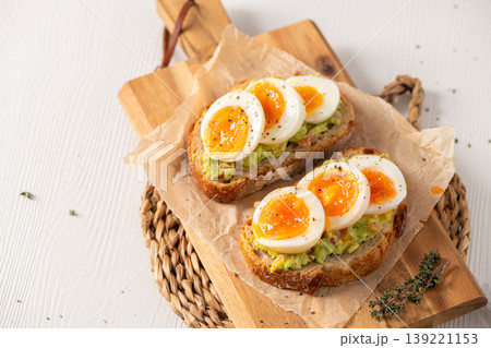 Avocado Toast with Soft Boiled Eggs on Sourdough Bread Avocado Toast with Soft Boiled Eggs on Sourdough Bread 139221153