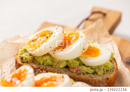 Avocado Toast with Soft Boiled Eggs on Sourdough Bread Avocado Toast with Soft Boiled Eggs on Sourdough Bread 139221156