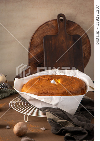Freshly Baked Sponge Cake on Cooling Rack with Rustic Wood Background Freshly Baked Sponge Cake on Cooling Rack with Rustic Wood Background 139221207