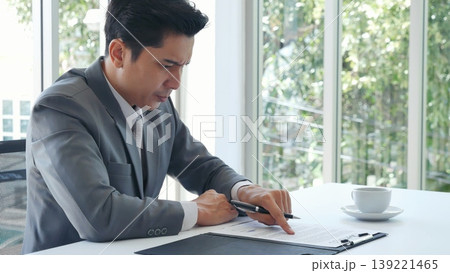Failure businessman stress bankruptcy man sitting wood desk feeling nagative depression have headache. Men unemployed jobless recession crisis stress lost job. Despair Failure businesspeople concept Failure businessman stress bankruptcy man sitting wood desk feeling nagative depression have headache. Men unemployed jobless recession crisis stress lost job. Despair Failure businesspeople concept 139221465