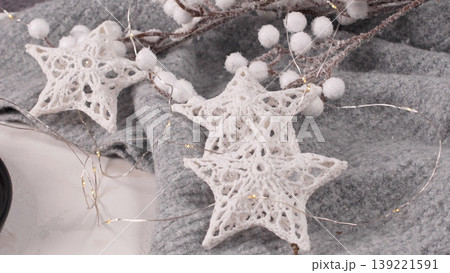 Stars with lights on gray woolen background Stars with lights on gray woolen background 139221591