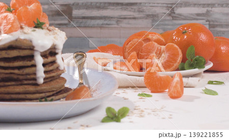 Pancakes with yogurt and tangerines 139221855