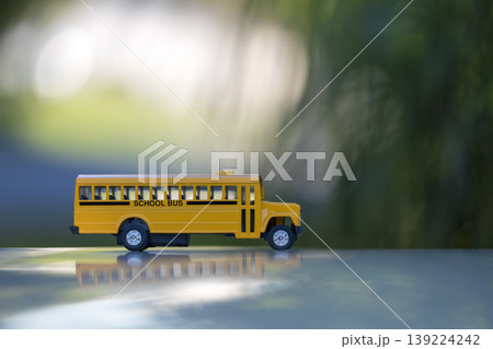 Model of classical american yellow school bus for transporting of kids to and from school every day. Concept of education in the USA Model of classical american yellow school bus for transporting of kids to and from school every day. Concept of education in the USA 139224242
