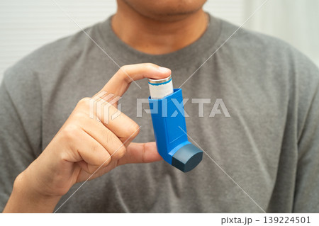 Asthma and chronic obstructive pulmonary disease COPD, Asian teenage using metered dose inhaler MDI. 139224501