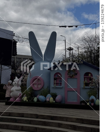 Charming Easter scene featuring a bunny and vibrant decorations. Charming Easter scene featuring a bunny and vibrant decorations. 139224679