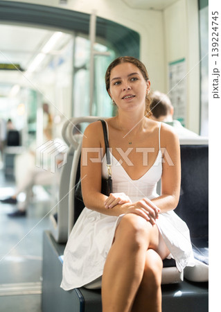 Young woman sitting quietly in bright modern tram Young woman sitting quietly in bright modern tram 139224745
