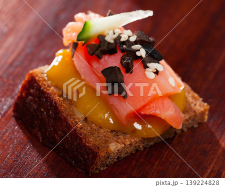 Canape with salmon and mango sauce Canape with salmon and mango sauce 139224828