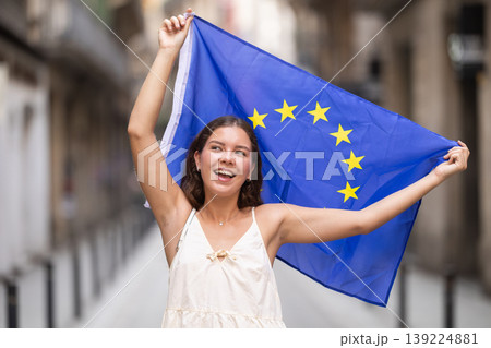 Young woman with EU flag on city street 139224881