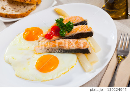 Fried eggs with salmon and asparagus 139224945