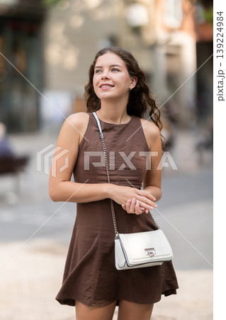 Young woman walking around the city in summer 139224984