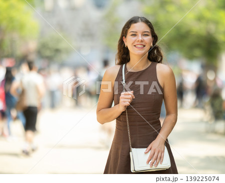 Woman walking in the park in summer Woman walking in the park in summer 139225074
