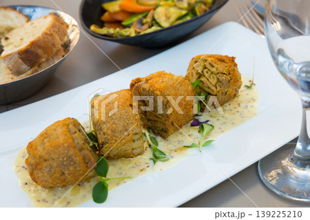 Prepared tasty andouillette artisanale from casings served at plate Prepared tasty andouillette artisanale from casings served at plate 139225210