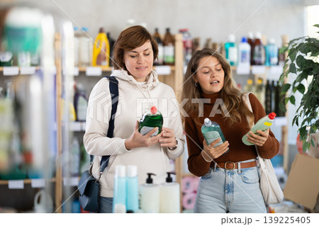 Two women choosing dishwashing liquid in department store 139225405