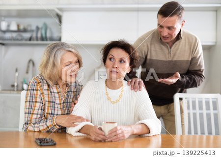 Family quarrel, old woman calming woman Family quarrel, old woman calming woman 139225413