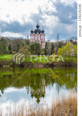 Panoramic View of Curchi Monastery Reflected in Peaceful Lake Water 139226286