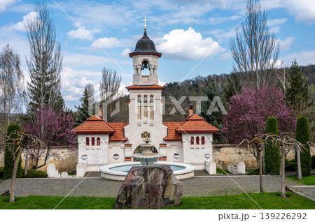 White Bell Tower and Stone Fountain at Curchi Monastery Grounds 139226292