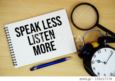 Speak Less Listen More text written on notepad with alarm clock and magnifying glass flat lay on wooden background Speak Less Listen More text written on notepad with alarm clock and magnifying glass flat lay on wooden background 139227176