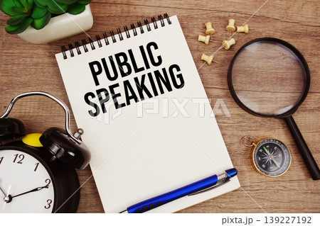 Public Speaking text written on notepad with alarm clock, compass and magnifying glass flat lay on wooden background Public Speaking text written on notepad with alarm clock, compass and magnifying glass flat lay on wooden background 139227192