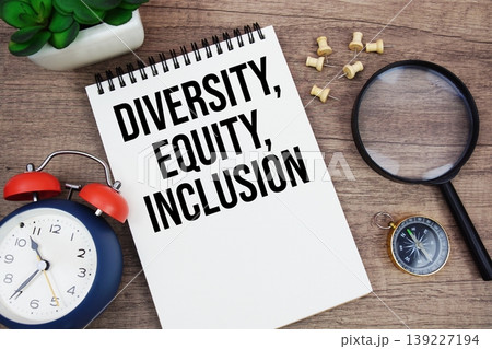 Diversity, Equity, Inclusion text written on notepad with alarm clock, compass and magnifying glass flat lay on wooden background Diversity, Equity, Inclusion text written on notepad with alarm clock, compass and magnifying glass flat lay on wooden background 139227194