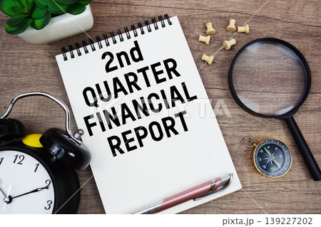 2nd Quarter Financial Report text written on notepad with alarm clock, compass and magnifying glass flat lay on wooden background 2nd Quarter Financial Report text written on notepad with alarm clock, compass and magnifying glass flat lay on wooden background 139227202