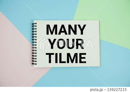 Mange Your Time text written on notepad flat lay on multicolor pastel background 139227215