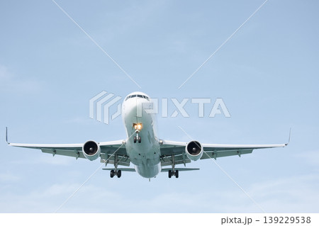 A huge passenger plane is landing in airport of Phuket, Thailand, a bottom view  139229538