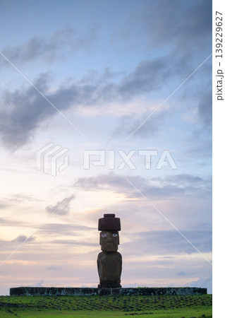 Calm and serene stone moai statue under dusk sky on easter island chile Calm and serene stone moai statue under dusk sky on easter island chile 139229627