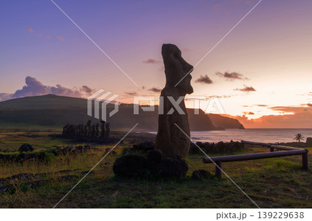 Peaceful silhouette of majestic moai statue at sunset on easter island chile Peaceful silhouette of majestic moai statue at sunset on easter island chile 139229638