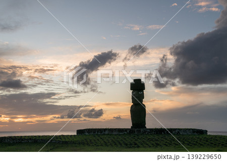 Stoic moai statue standing on easter island chile at peaceful sunset Stoic moai statue standing on easter island chile at peaceful sunset 139229650