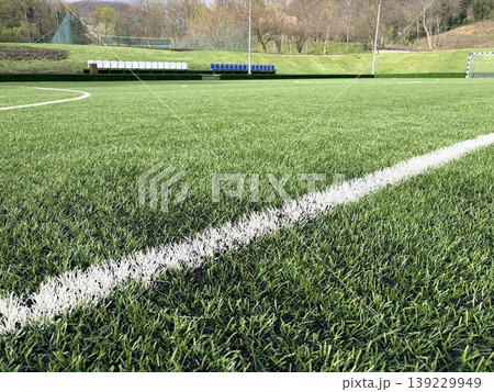 White stripe on the green soccer field close up White stripe on the green soccer field close up 139229949