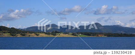 Blue sea, farm land and mountains in Rogaland, Norway. Blue sea, farm land and mountains in Rogaland, Norway. 139230419