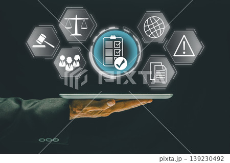 Businessman presenting digital compliance and regulation icons, symbolizing modern business technology and legal concepts. 139230492