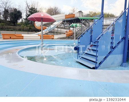 A children's pool with a spiral slide and stairs is being prepared for the beach season. A children's pool with a spiral slide and stairs is being prepared for the beach season. 139231044