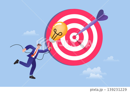 Man holding glowing lightbulb running towards a big target with dart representing innovative strategy successful marketing reaching objective and creative solution in business 139231229