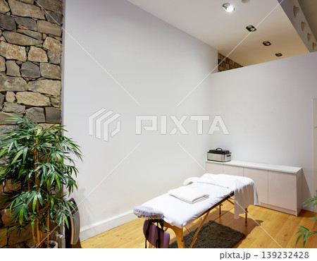 Massage room with massage table Massage room with massage table 139232428