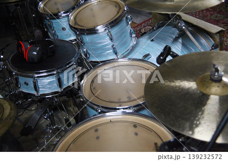 Drums are set up in a music studio with microphones attached. Drums are set up in a music studio with microphones attached. 139232572