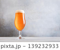 Glass of fresh craft premium lager ale beer on light table background. 139232933