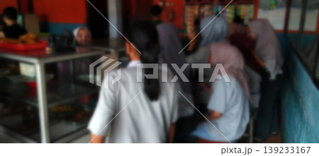 The atmosphere of the school canteen with students queuing to buy food. The atmosphere of the school canteen with students queuing to buy food. 139233167