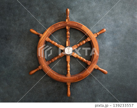 Wooden metal old steering wheel on a dark background. 139233557