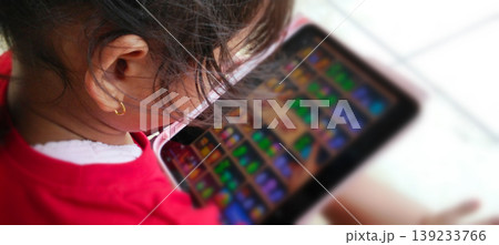 Children Play with Tablets with Focus on Digital Screens 139233766