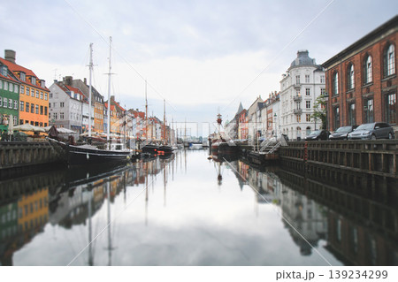 Reflections of Nyhavn canal and colorful buildings in Copenhagen 139234299