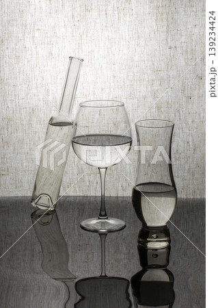 Still life with glassware on a gray background Still life with glassware on a gray background 139234424