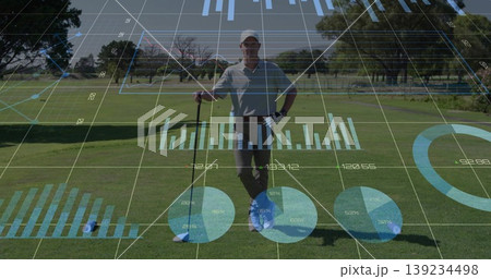 Standing solo male golfer holding club on fairway, with ball on tee and digital data overlays Standing solo male golfer holding club on fairway, with ball on tee and digital data overlays 139234498