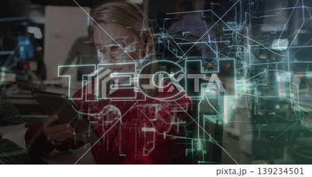 Blond professional in red blouse reviewing tablet in modern tech office, with holographic circuits Blond professional in red blouse reviewing tablet in modern tech office, with holographic circuits 139234501