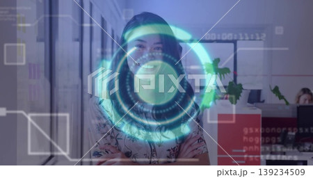 Standing businesswoman in floral blouse projecting interface in open-plan office, coworker typing Standing businesswoman in floral blouse projecting interface in open-plan office, coworker typing 139234509