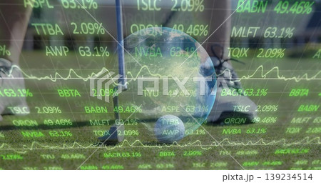 Resting glass globe depicting Earth on courtyard lawn, with metal post and green ticker overlays Resting glass globe depicting Earth on courtyard lawn, with metal post and green ticker overlays 139234514