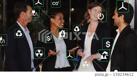 Discussing business professionals exploring energy saving in office lounge, with energy icons Discussing business professionals exploring energy saving in office lounge, with energy icons 139234612