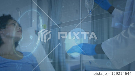 Lying patient watching gloved doctor adjusting IV beside hospital bed with holograms, copy space Lying patient watching gloved doctor adjusting IV beside hospital bed with holograms, copy space 139234644